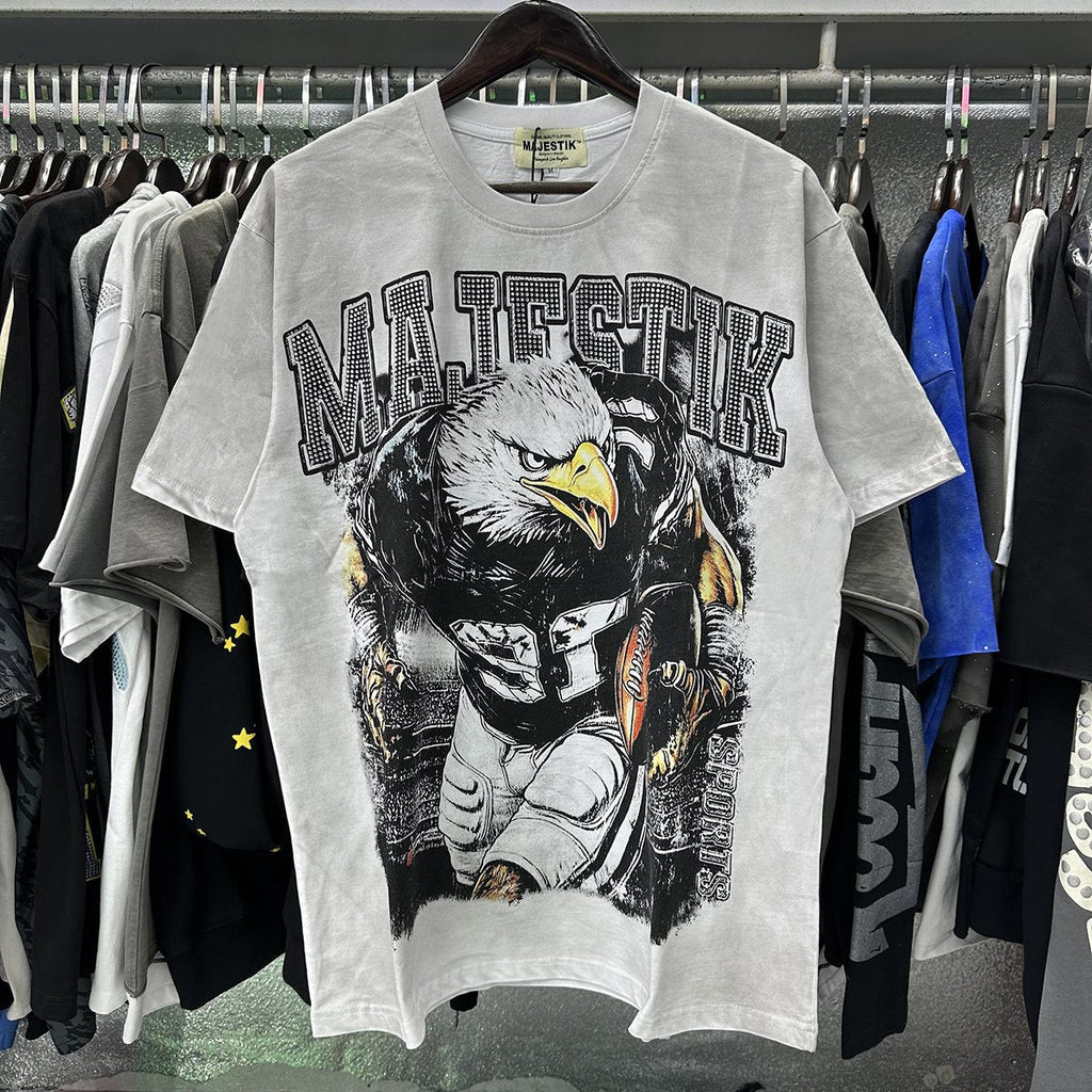 MAJESTIK Eagle Football Rhinestone Graphic T-Shirt
